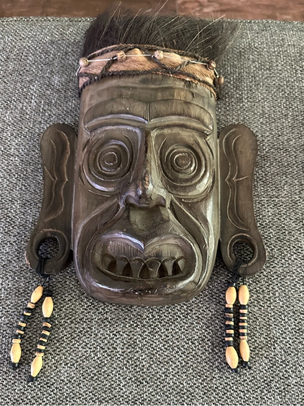 Hand-Carved Tribal Wooden Mask with Bead & Hair Accents - Dark Brown